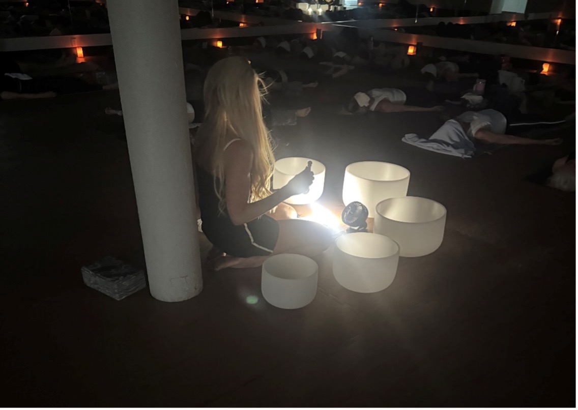 Instructor playing sound bowls